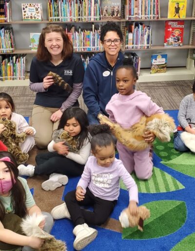 Kids showing stuffed animals after the zoo Storytime at Hillside Public Library